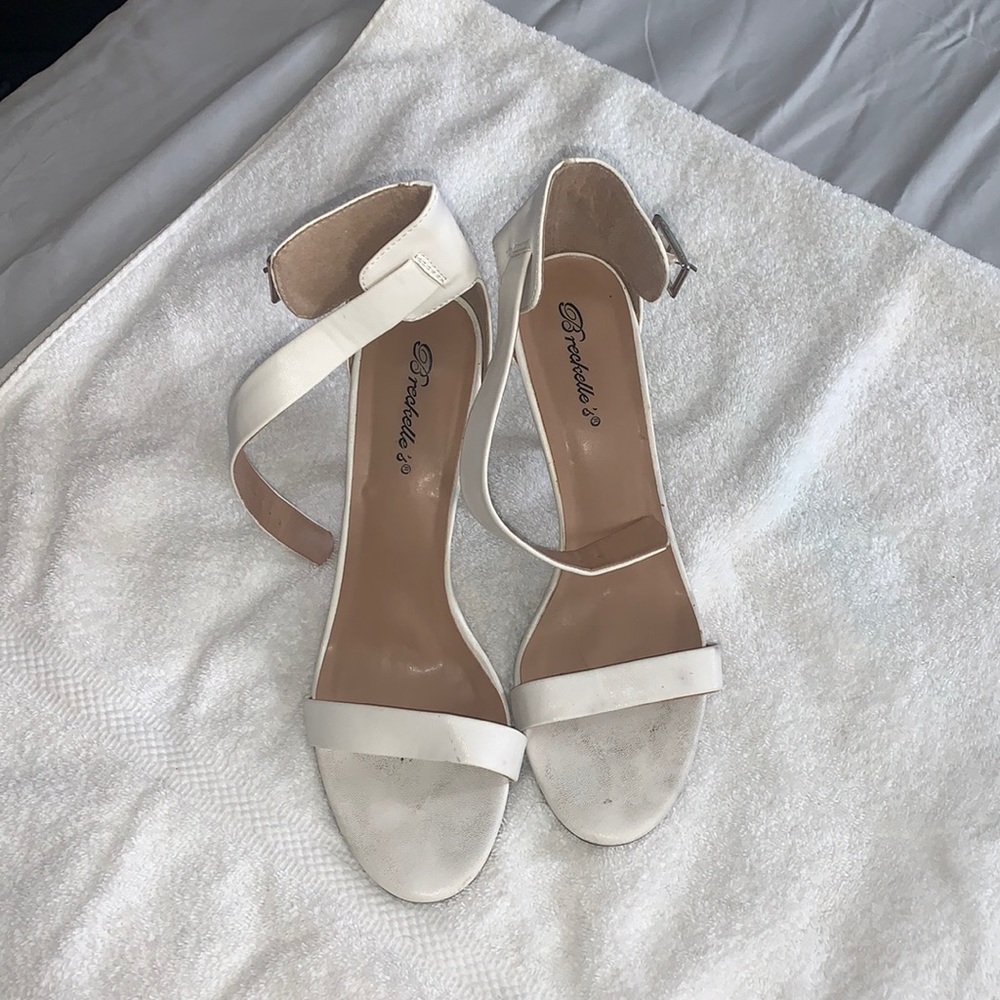 White heel size 9 used mid condition